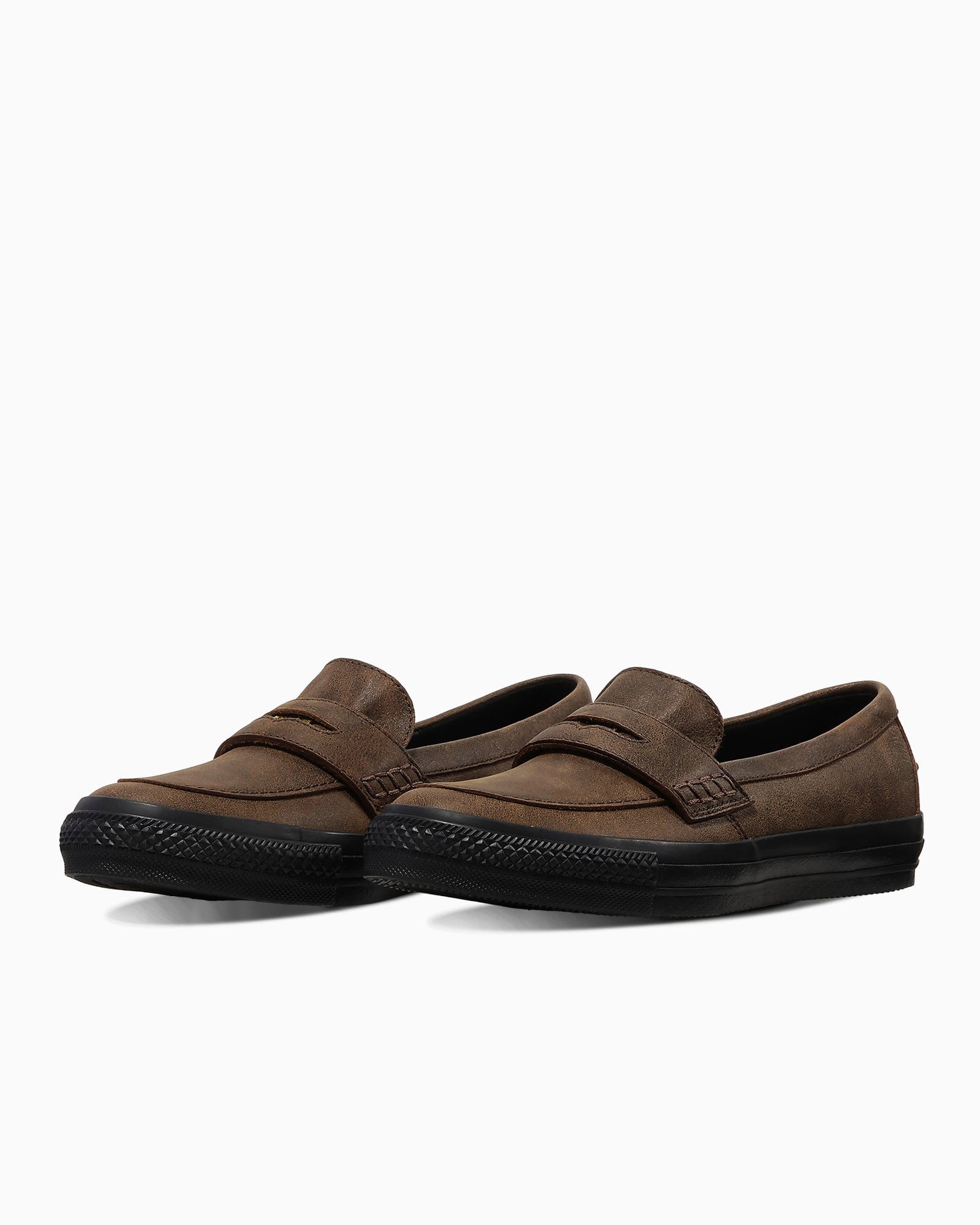 Dark-brown Converse Coinloafer pair in a three-quarter view.