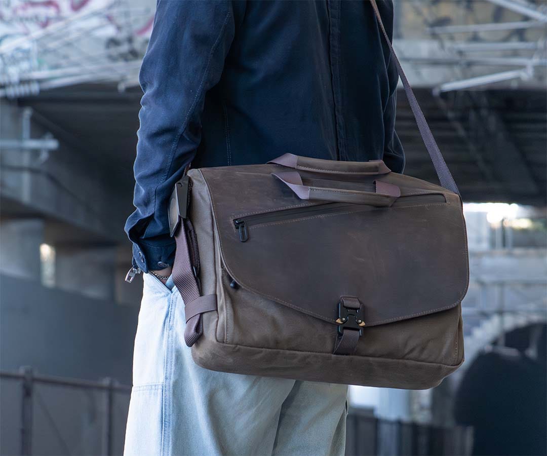 WaterField’s waxed-canvas Cargo worn at the hip with its leather flap closed.