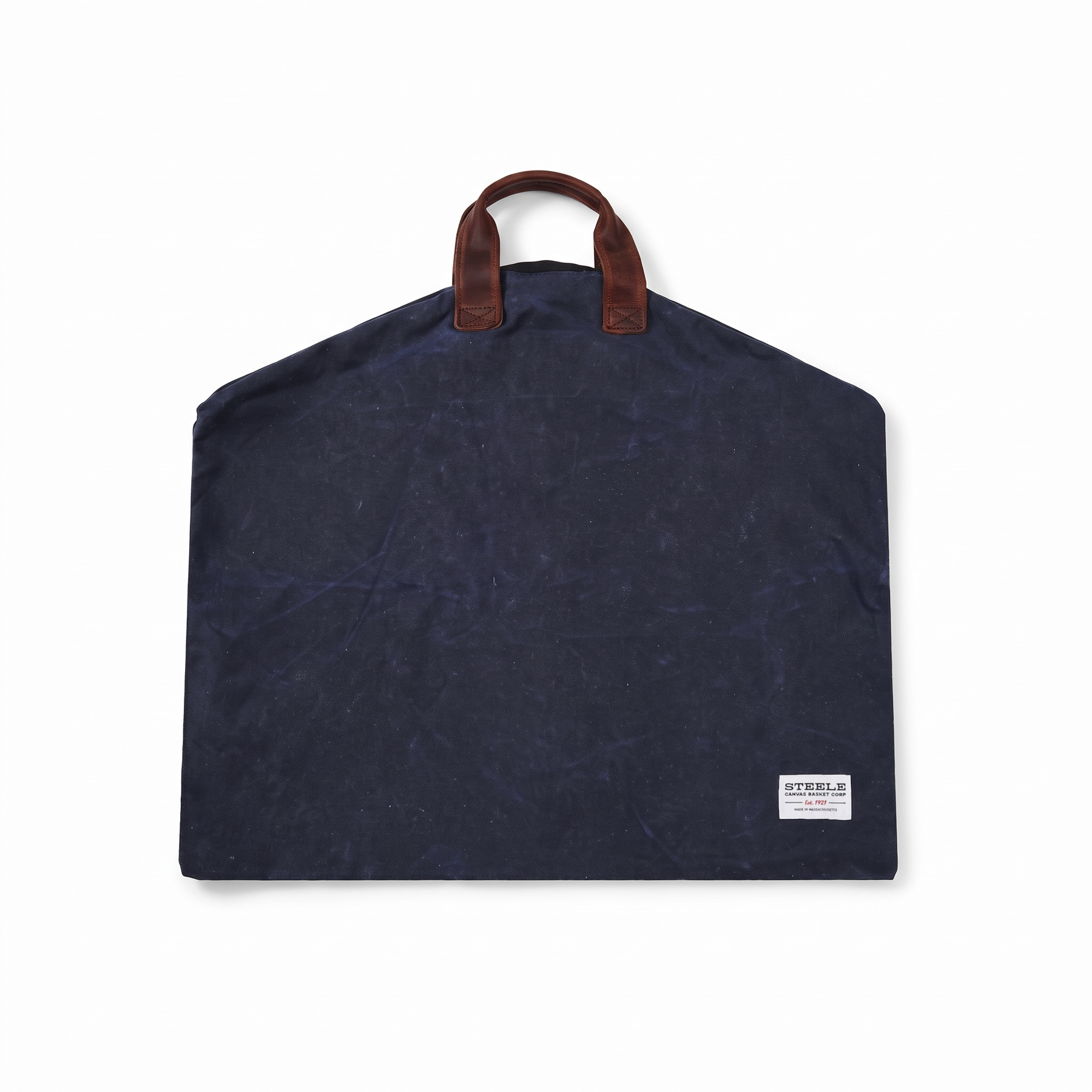 Navy Steele Canvas waxed garment bag folded into carry mode with handles.