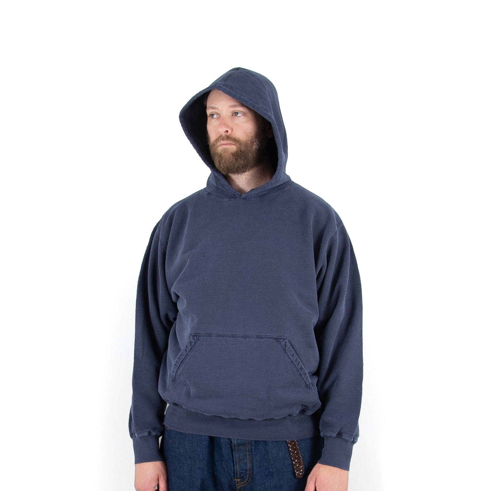 NAQP’s navy hoodie worn with the hood up, showing its roomy fit.