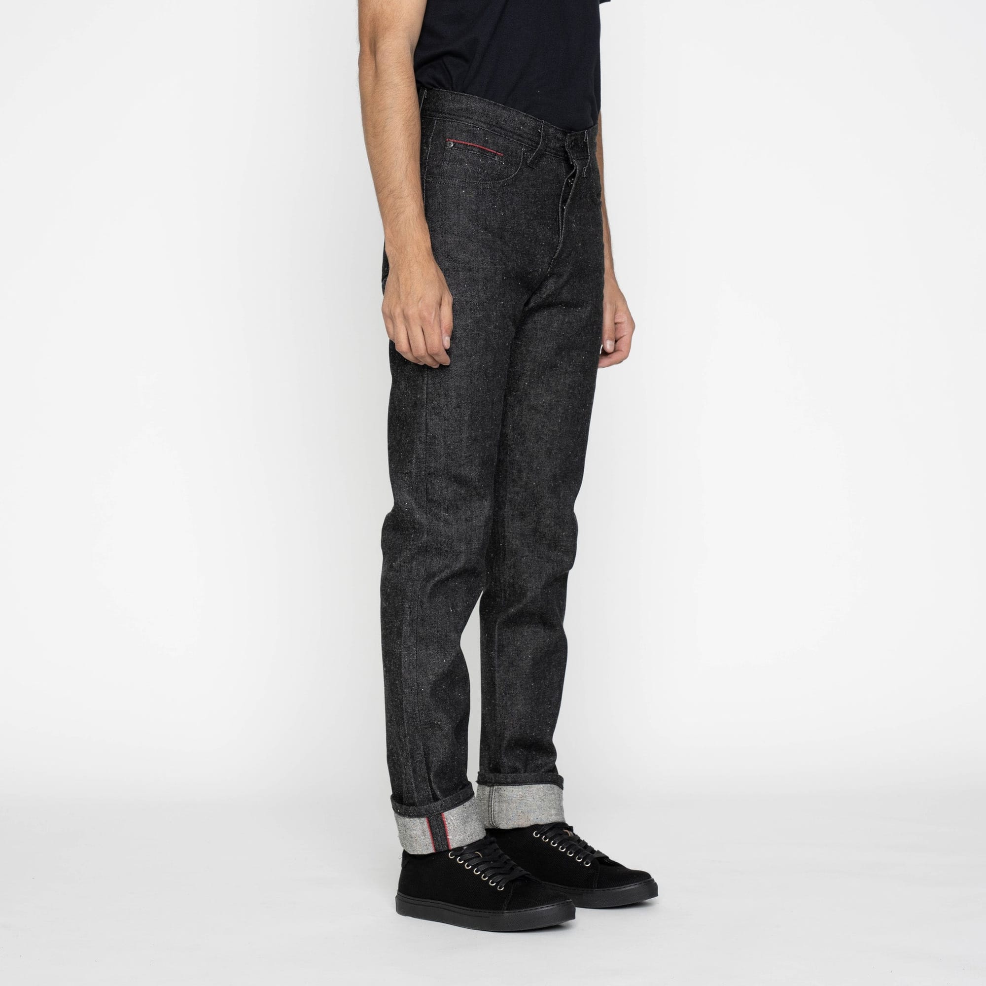 Side view of the black Weird Guy jeans.