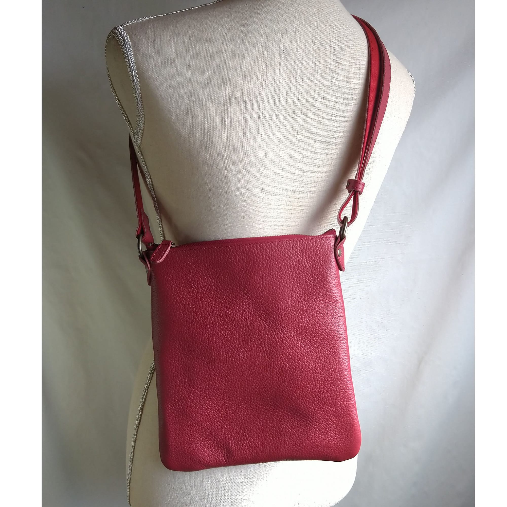 Red 557250 worn across a torso mannequin