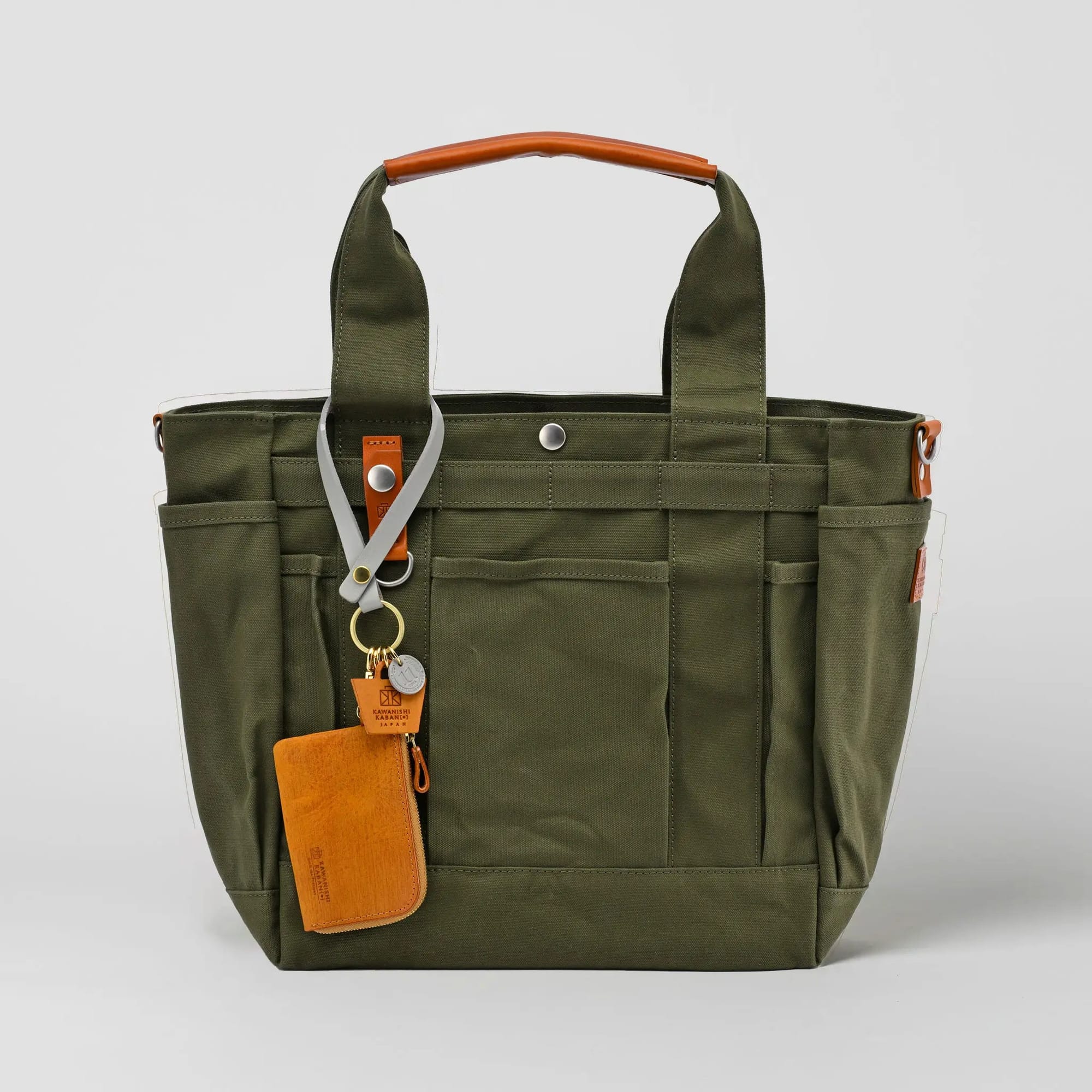 Olive full-size grabe tote with camel wallet charm
