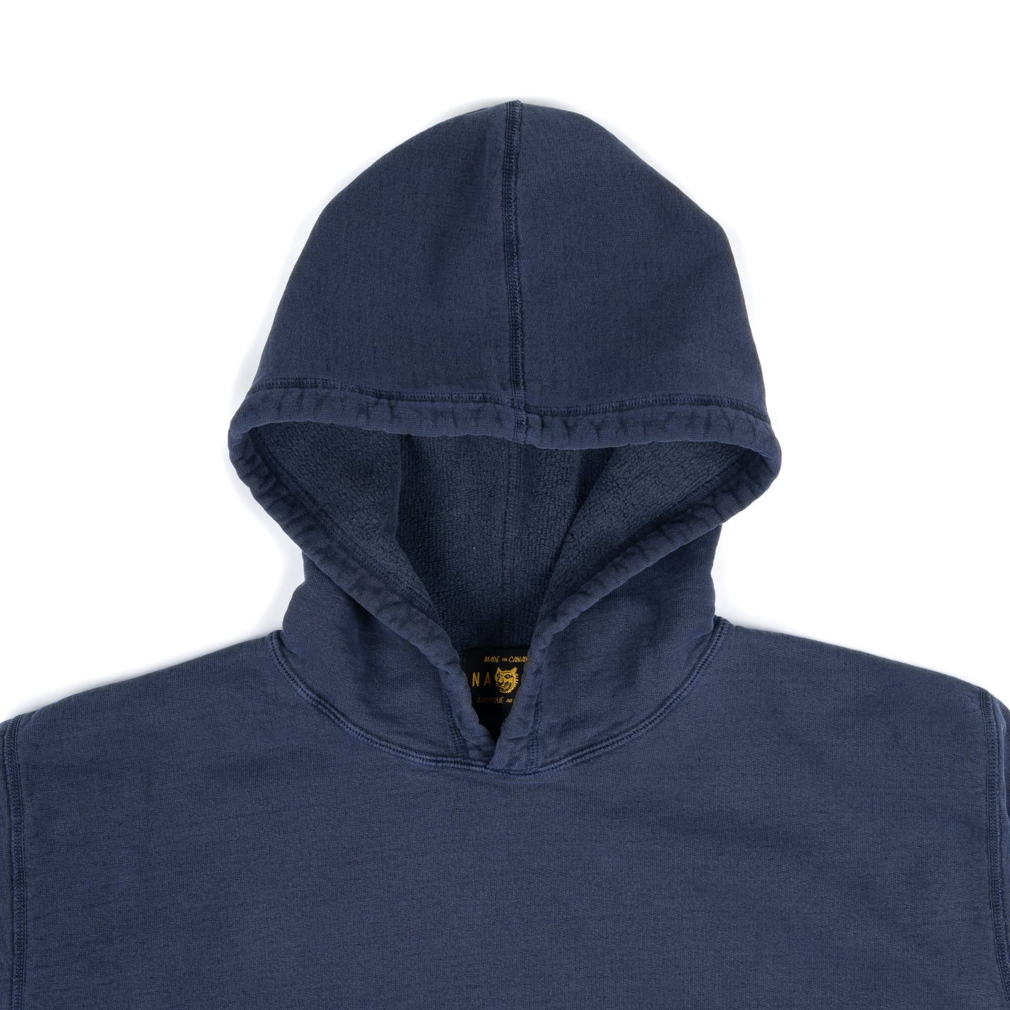 Close view of the navy hood and neckline.