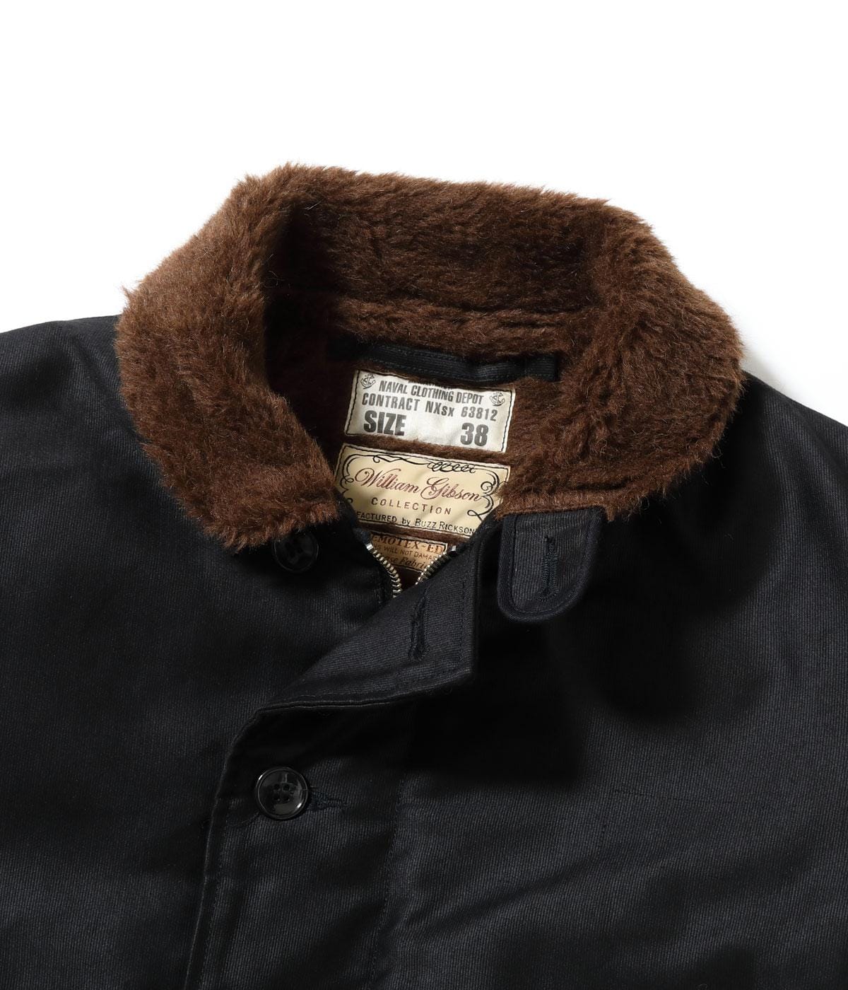 Pile collar, internal size labels and front placket viewed close.