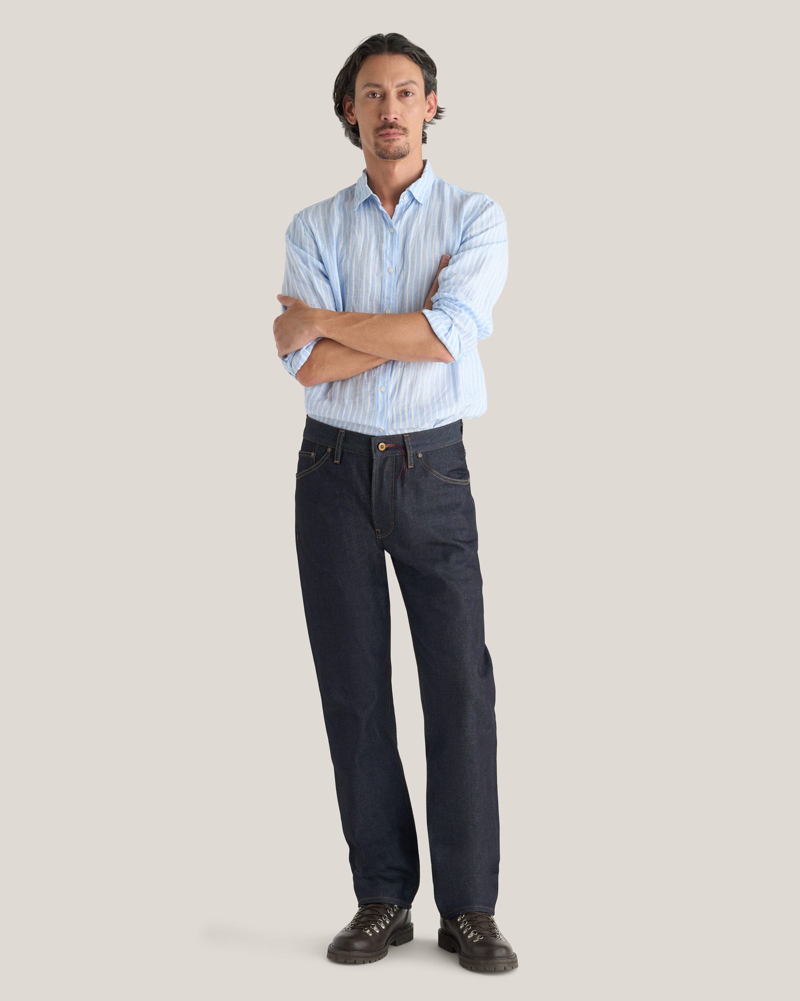 Hiut Benjamin Super Zero Indigo jeans worn with a light-blue shirt.