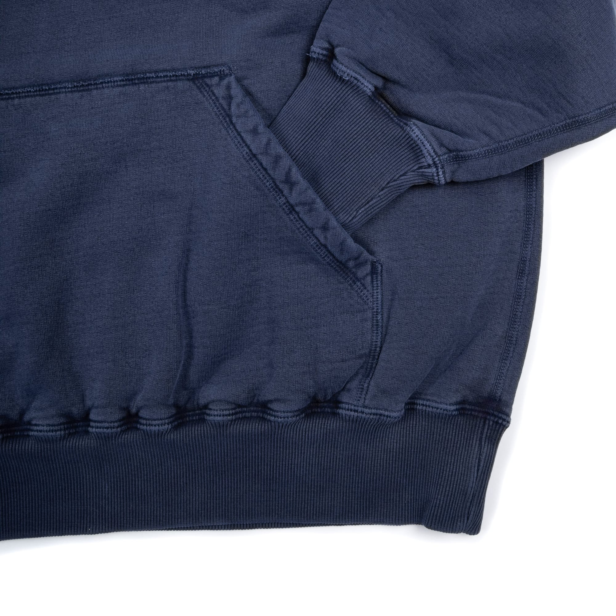 Ribbed cuff, hem and seam details on the NAQP hoodie.