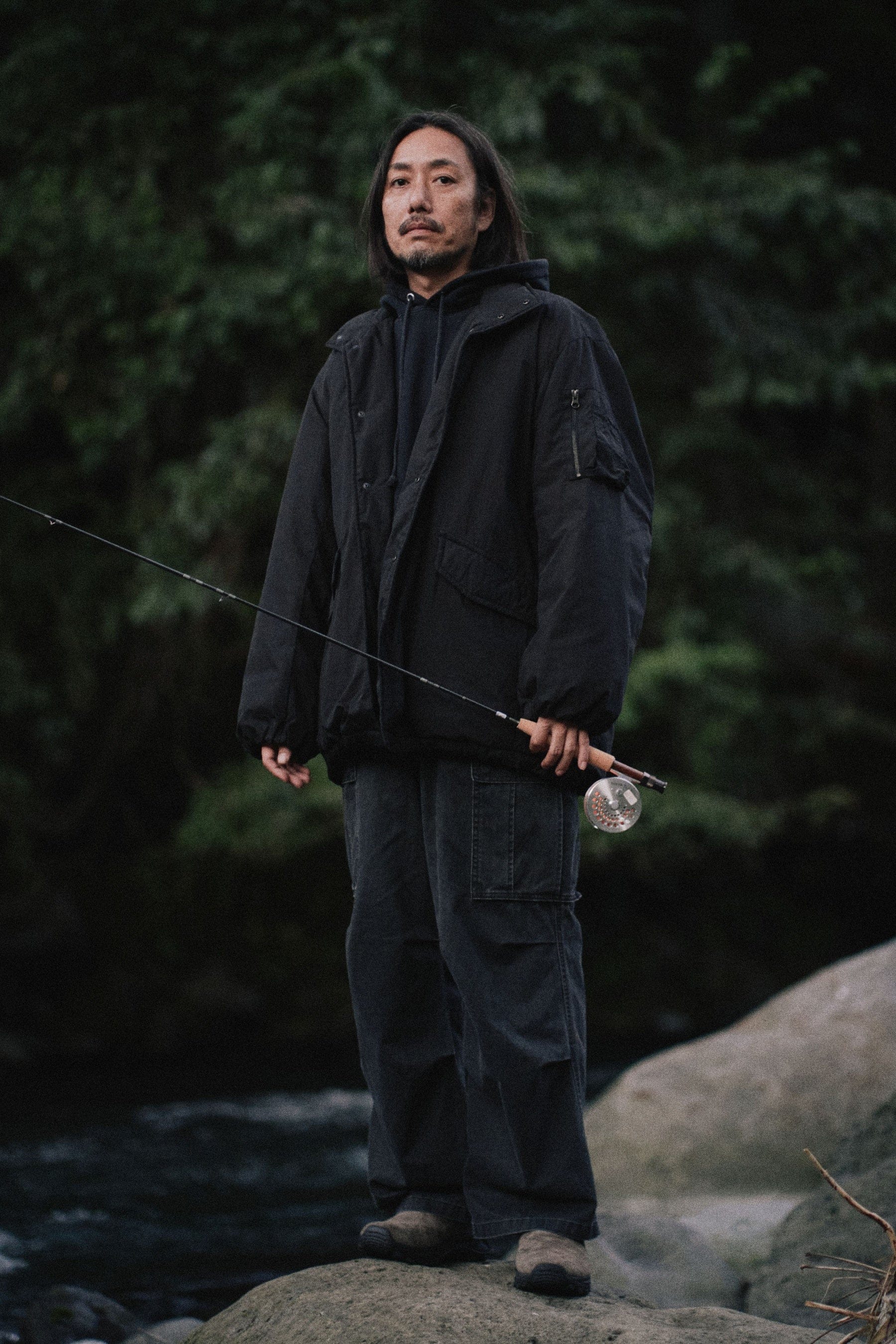 Parabola Padded Jacket worn beside a river