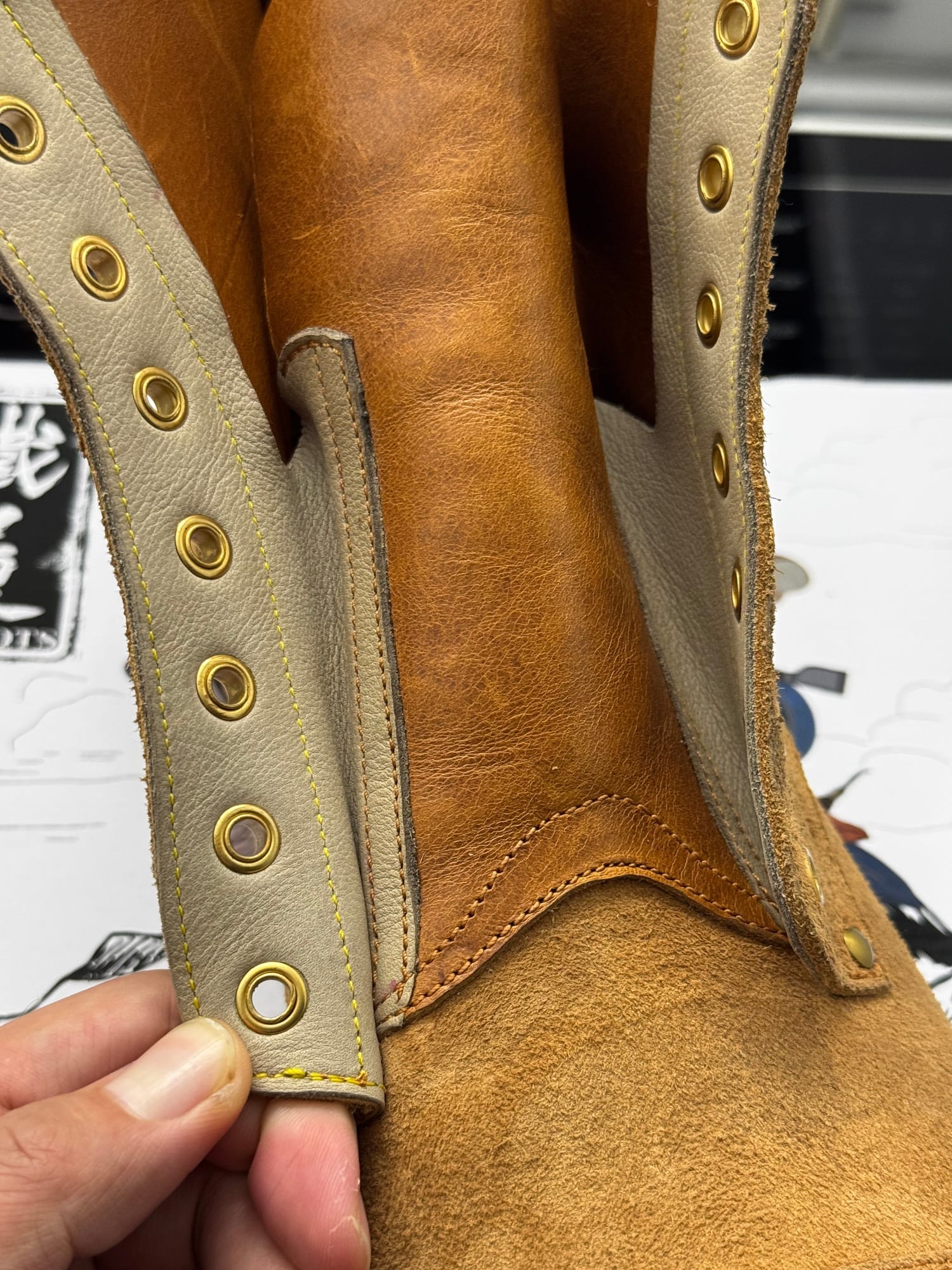 Close view inside the lacing, showing the three-piece bellows tongue.