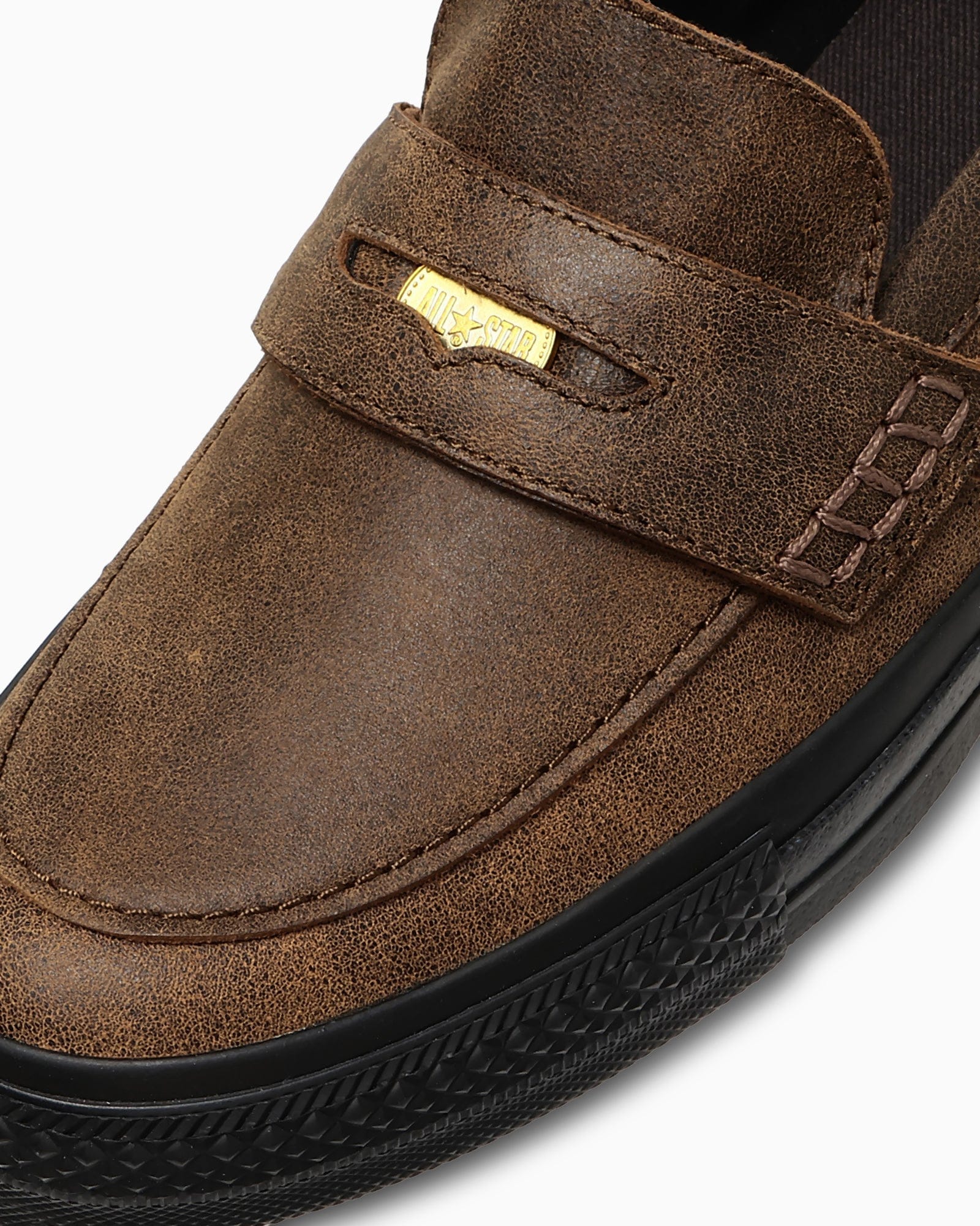 Close view of the loafer strap and removable coin.