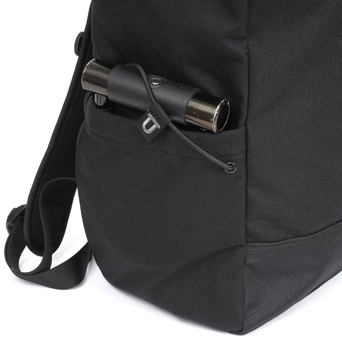 A U-lock secured by the side-pocket bungee.