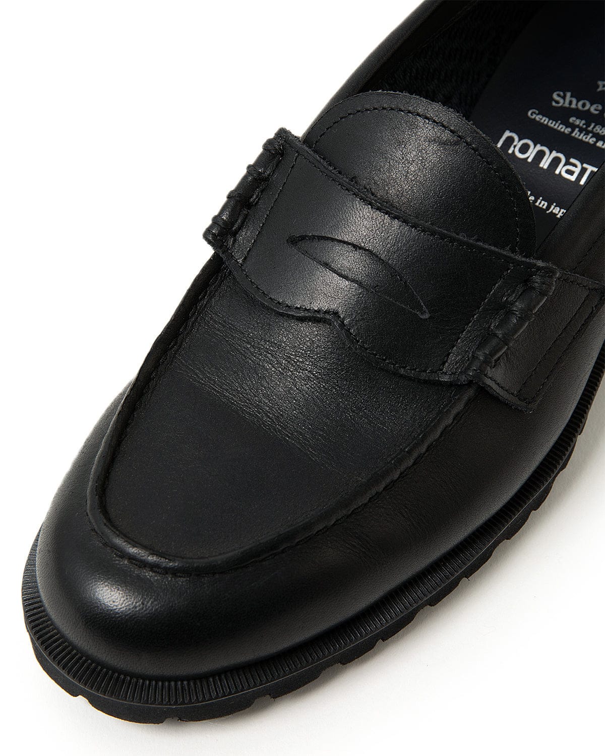 Close view of the leather vamp and loafer strap.