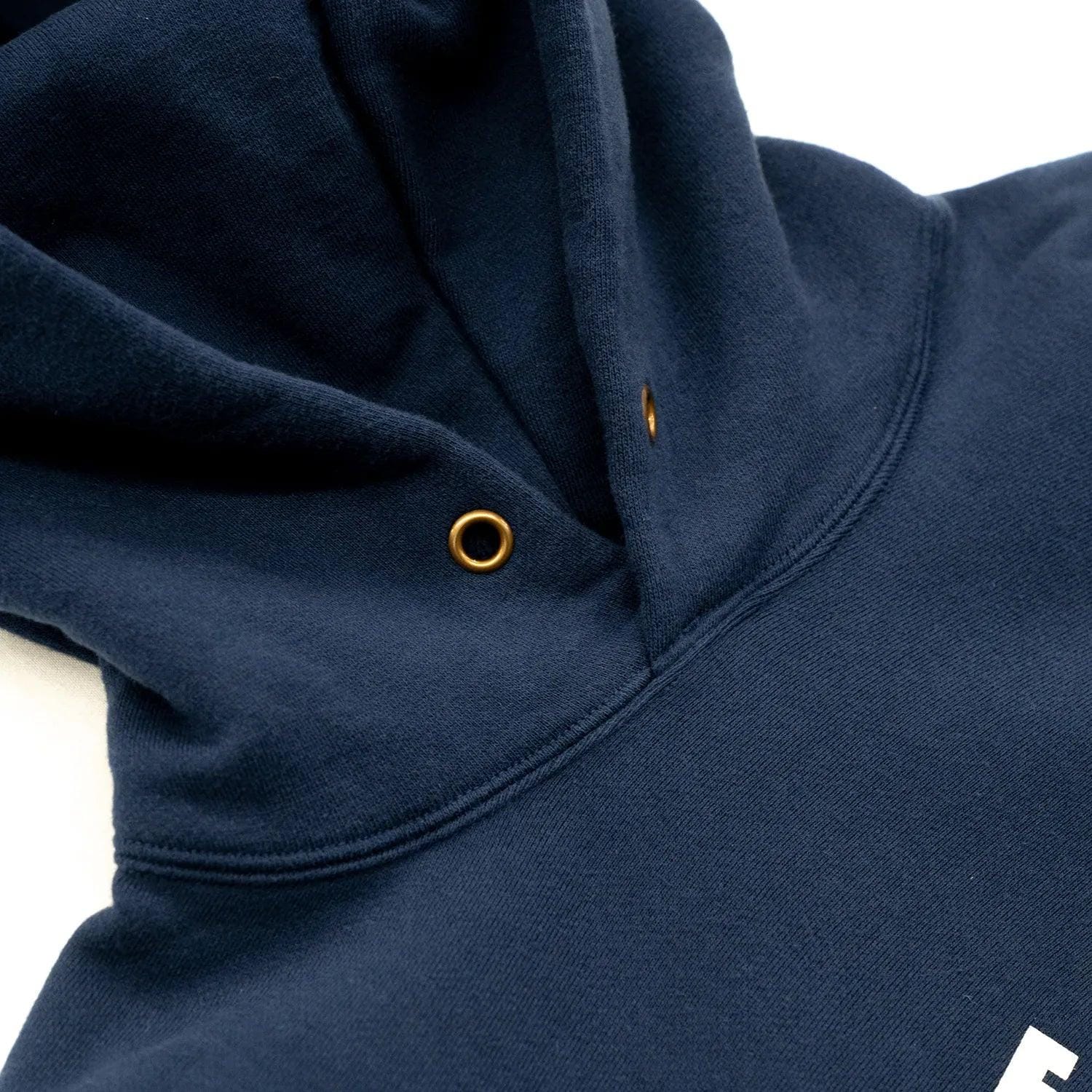 Hood drawstring eyelets and hood fabric on the parka.