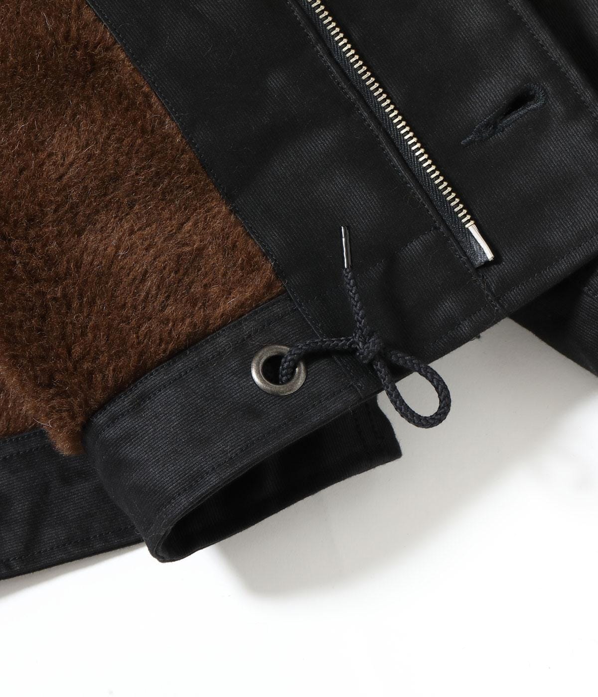 Jacket hem drawcord, zipper and interior pile visible together.