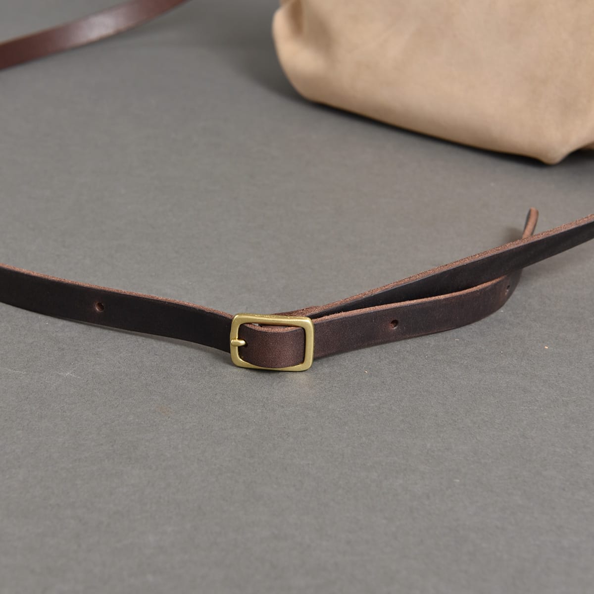 Adjustable leather shoulder strap and buckle on HERZ SUB2604.