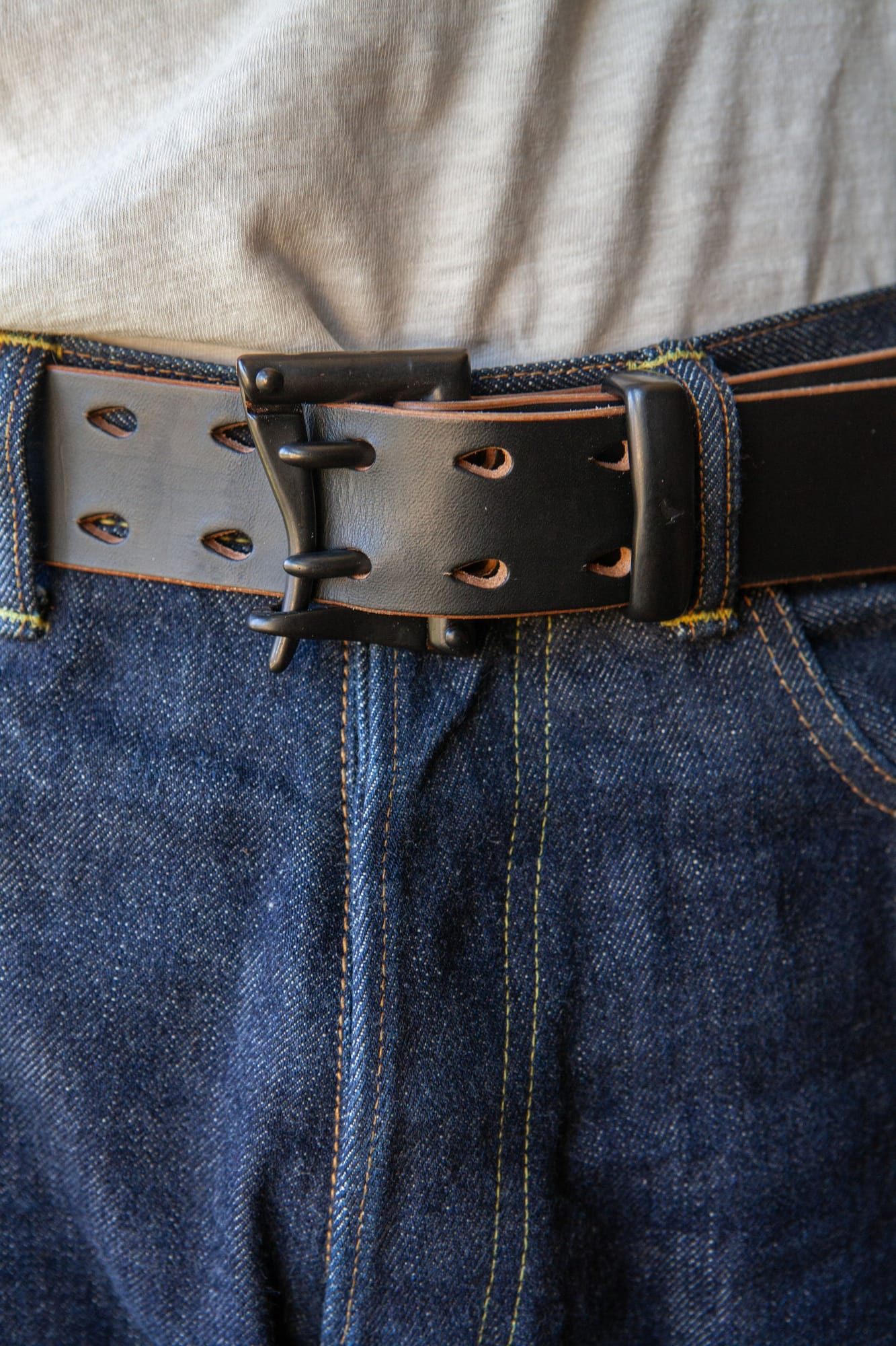 New riveted Pigeon Tree Ultimate Teacore belt worn through jeans belt loops.
