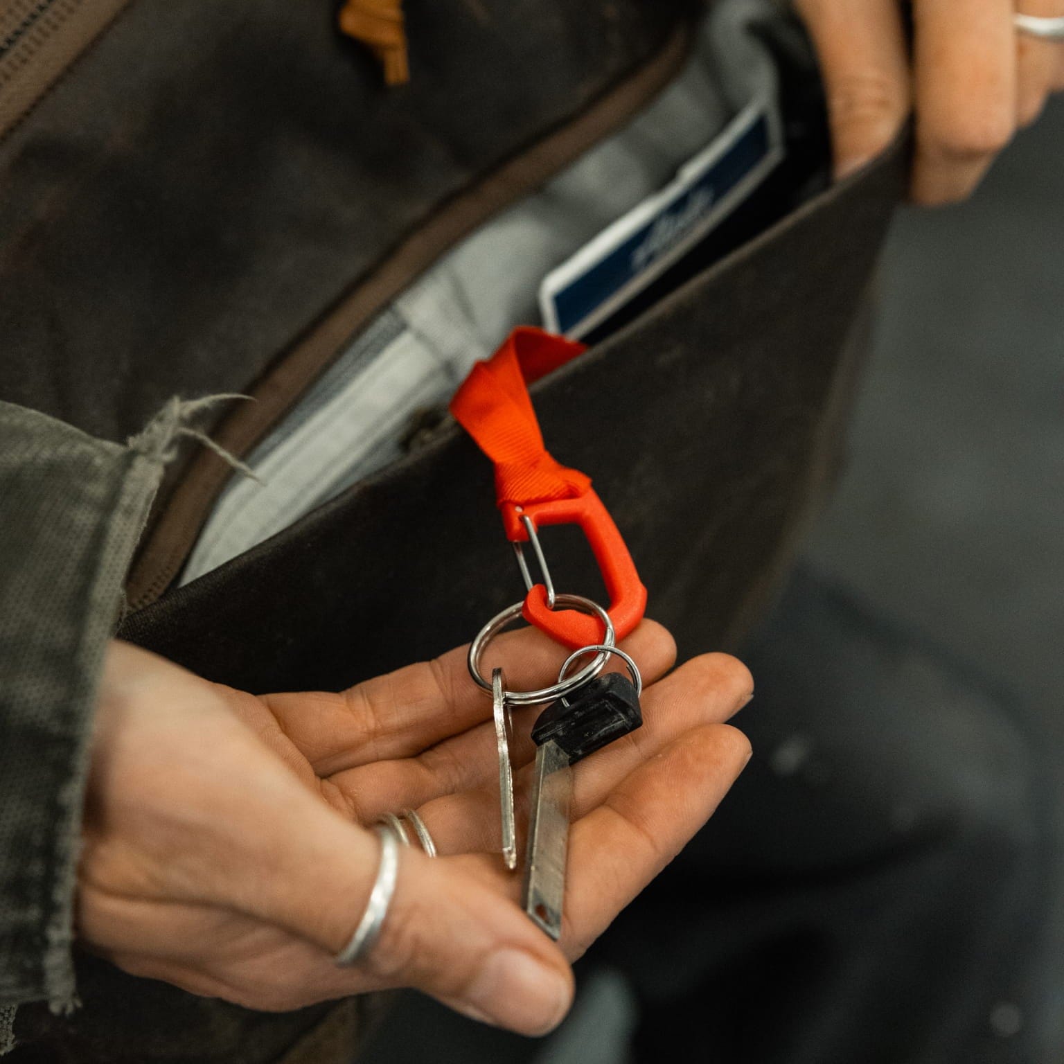 Close view of the key leash inside a CIVIC Travel Bag pocket.