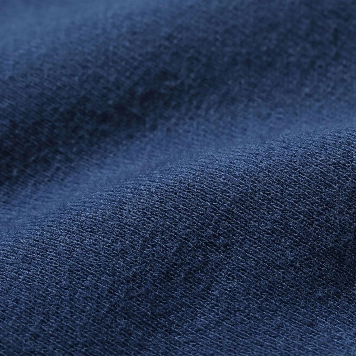 Tight close-up of navy sweatshirt fabric texture.