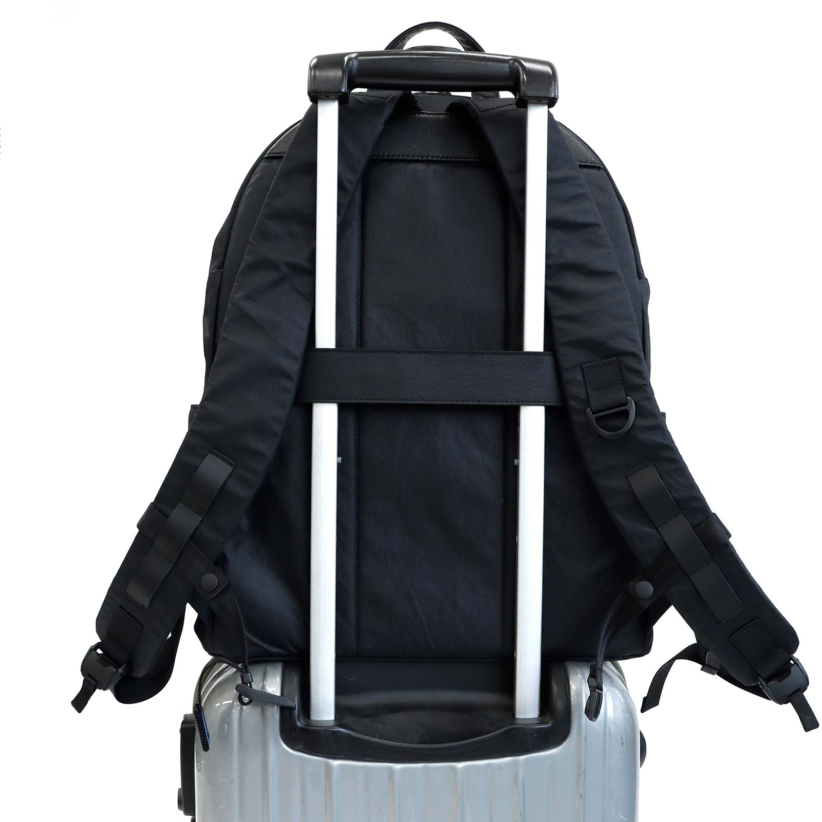 Float Daypack mounted on a suitcase handle