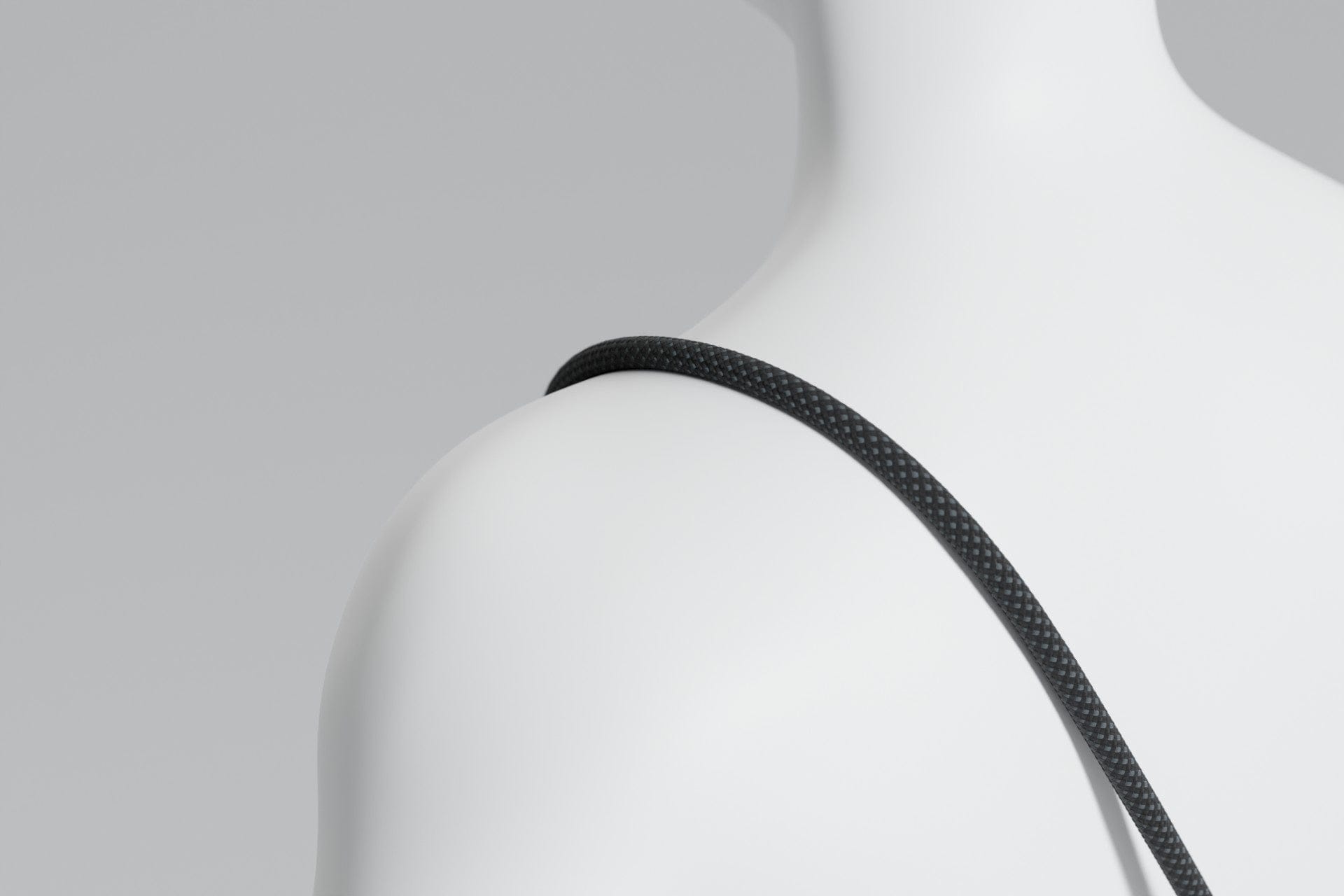 Black NODI cord following a rounded surface