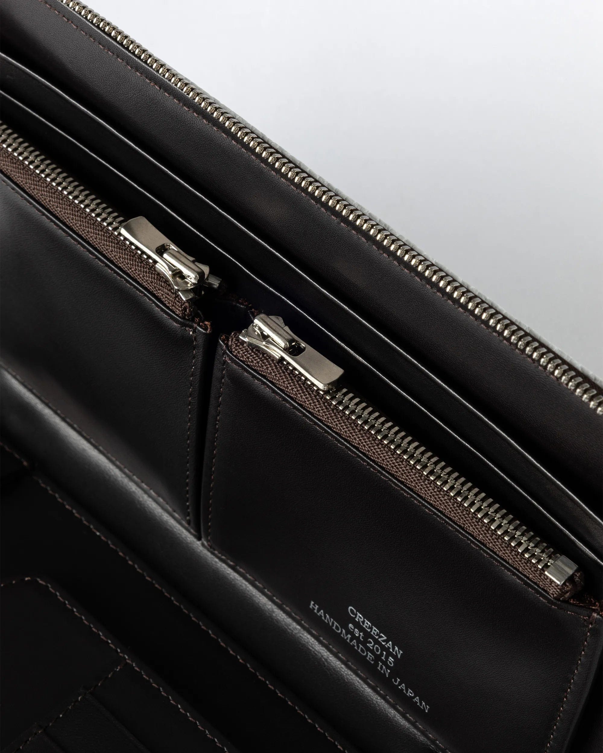 CJMK-002 interior zip compartments close-up