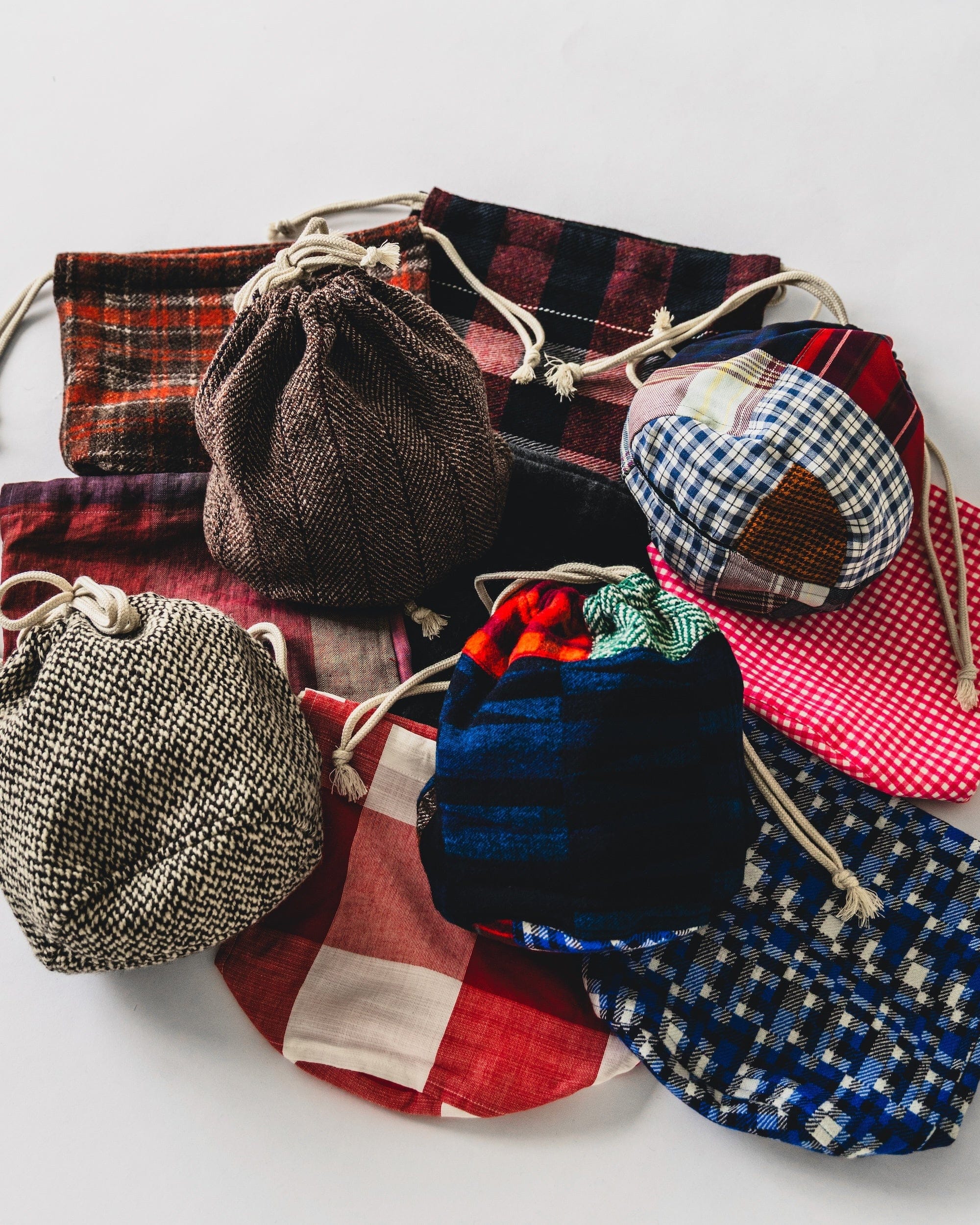 Welarch and BEAMS PLUS remnant-cloth drawstring pouches