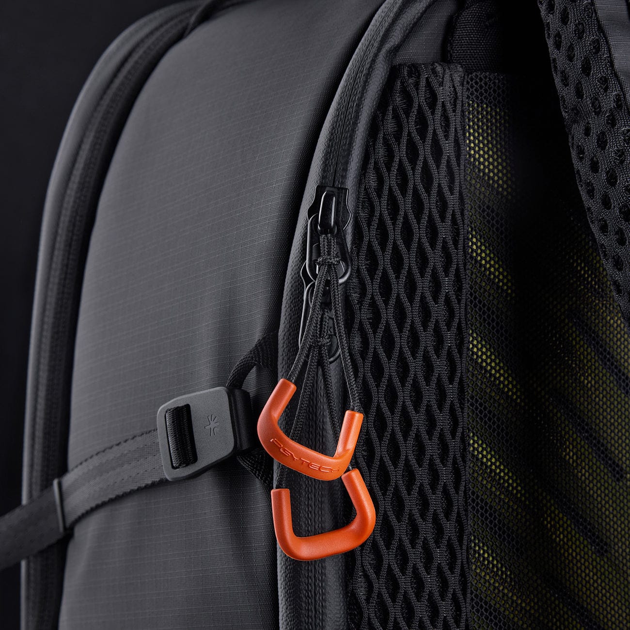OneMo 3 orange attachment loops beside a shoulder strap