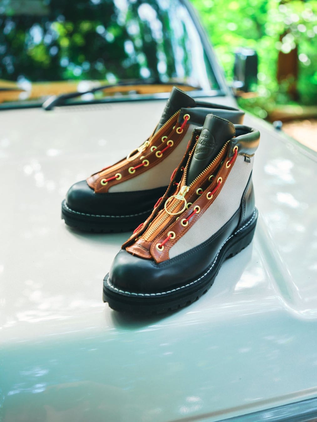 A pair of Danner Field R Overland boots on a Land Cruiser bonnet.