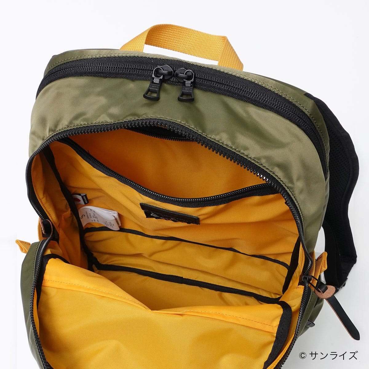 Open Lightning Backpack showing its yellow lining and internal pockets.