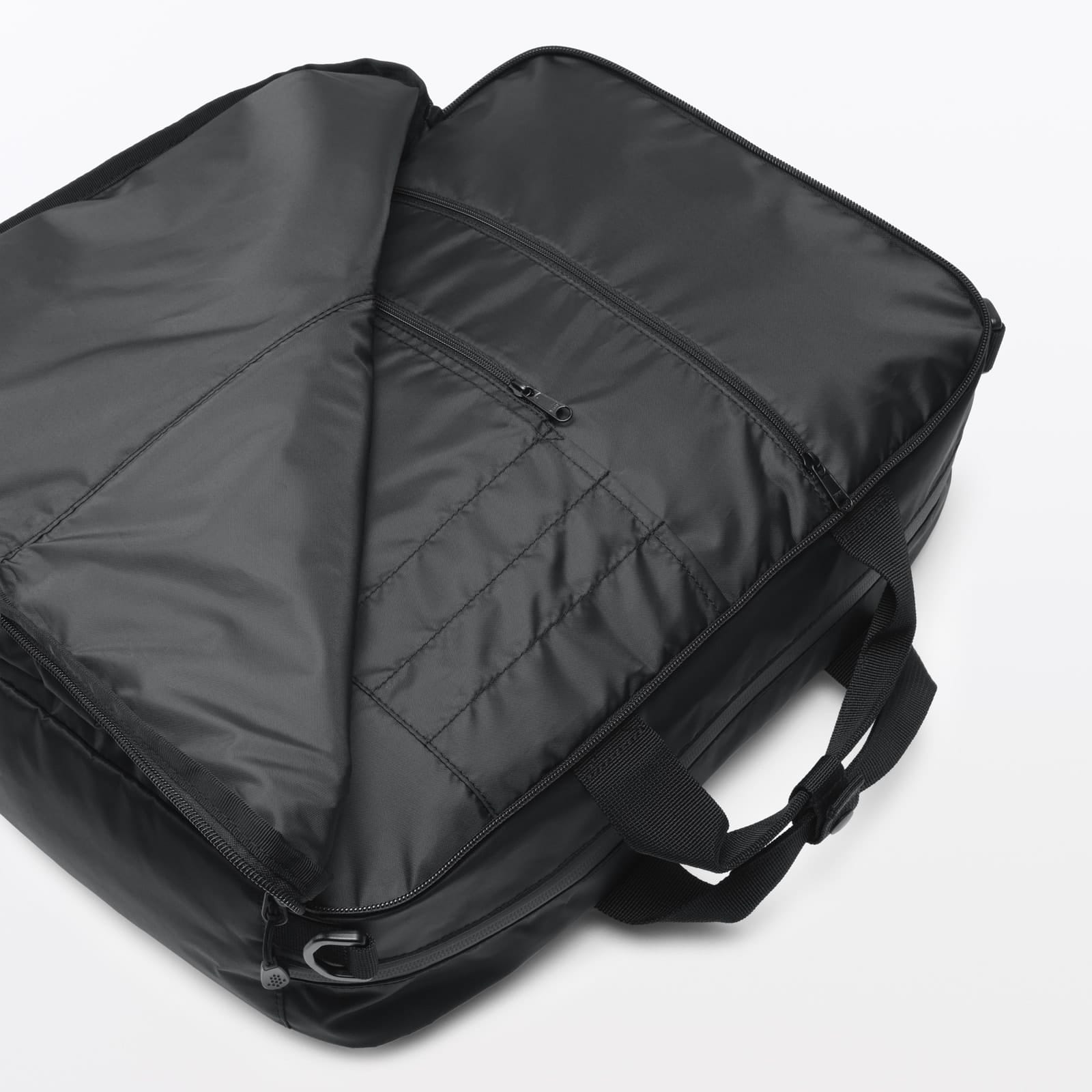 MUJI business bag open to show its main compartment and organiser pockets