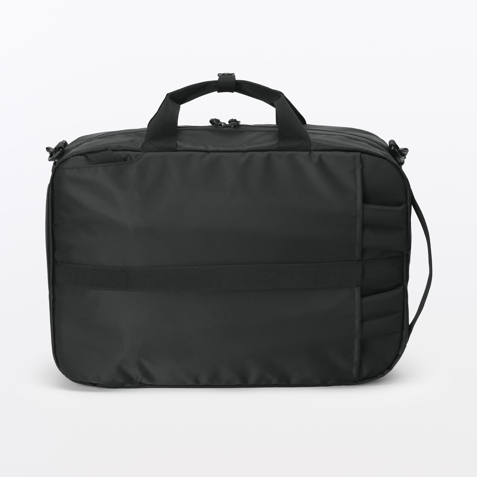 Rear of the MUJI bag showing its horizontal luggage attachment panel