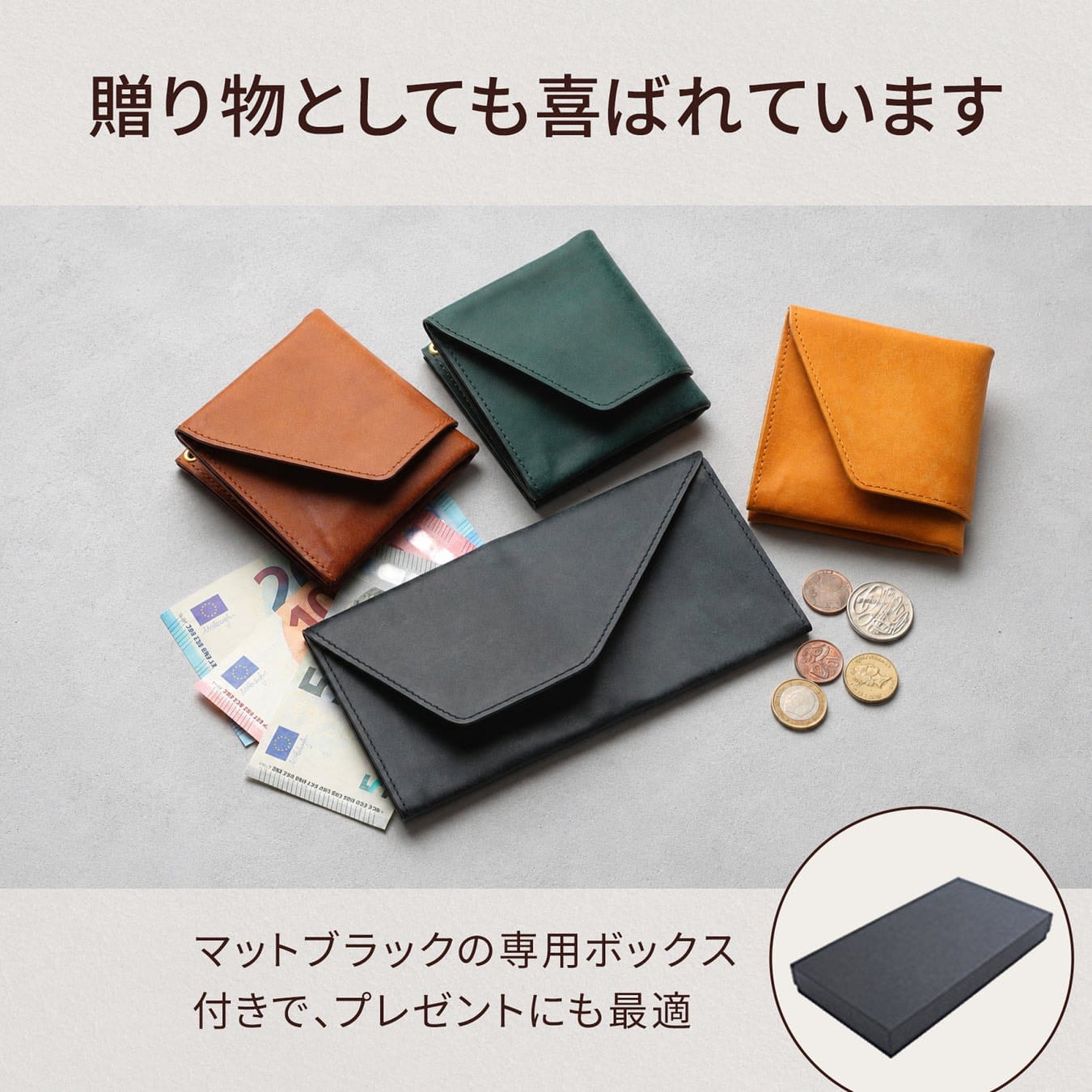 Four colours of the abrAsus Pueblo Travel Wallet with cash and coins on a grey surface.