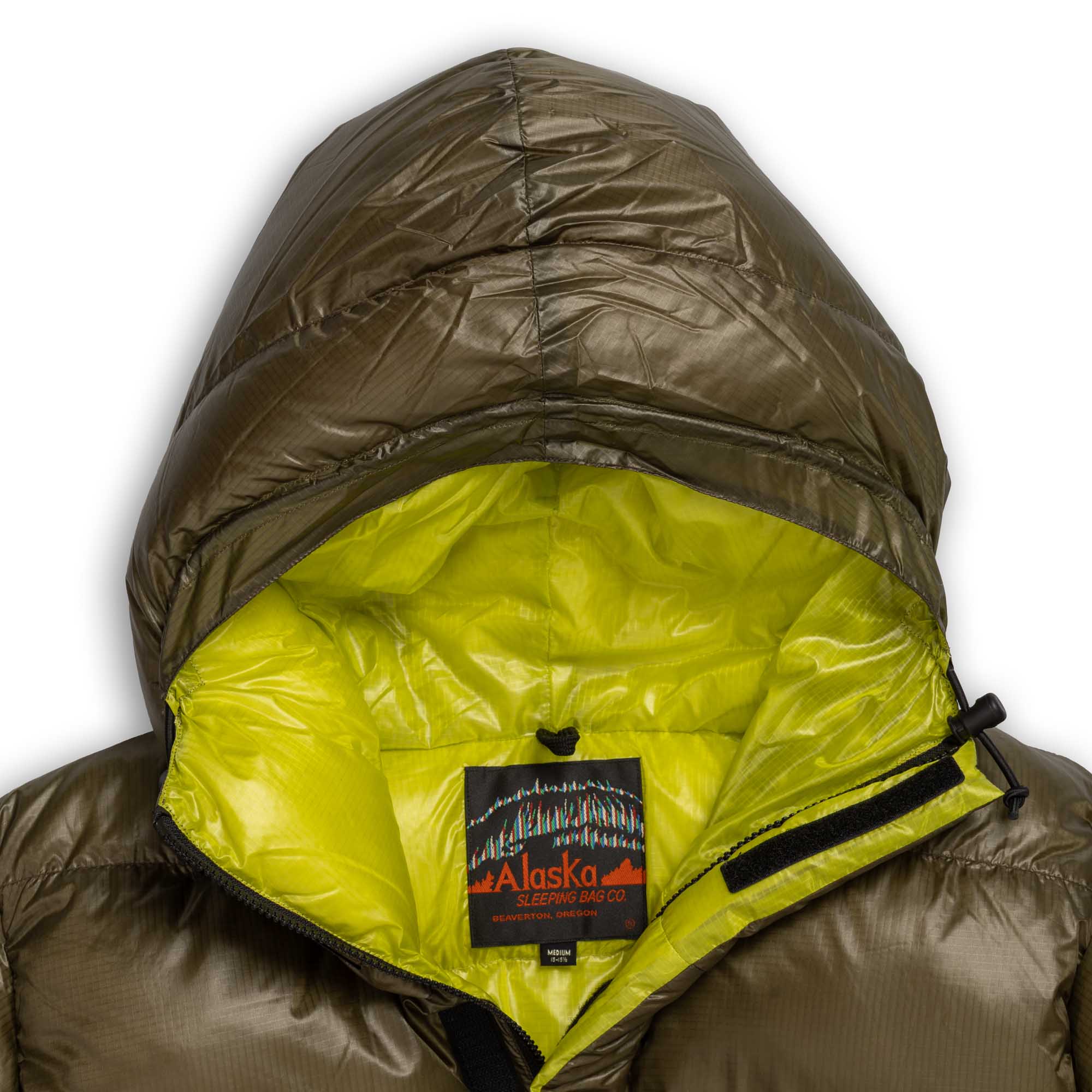 Open neckline of the Alaska Sleeping Bag parka showing its bright green lining and woven label.