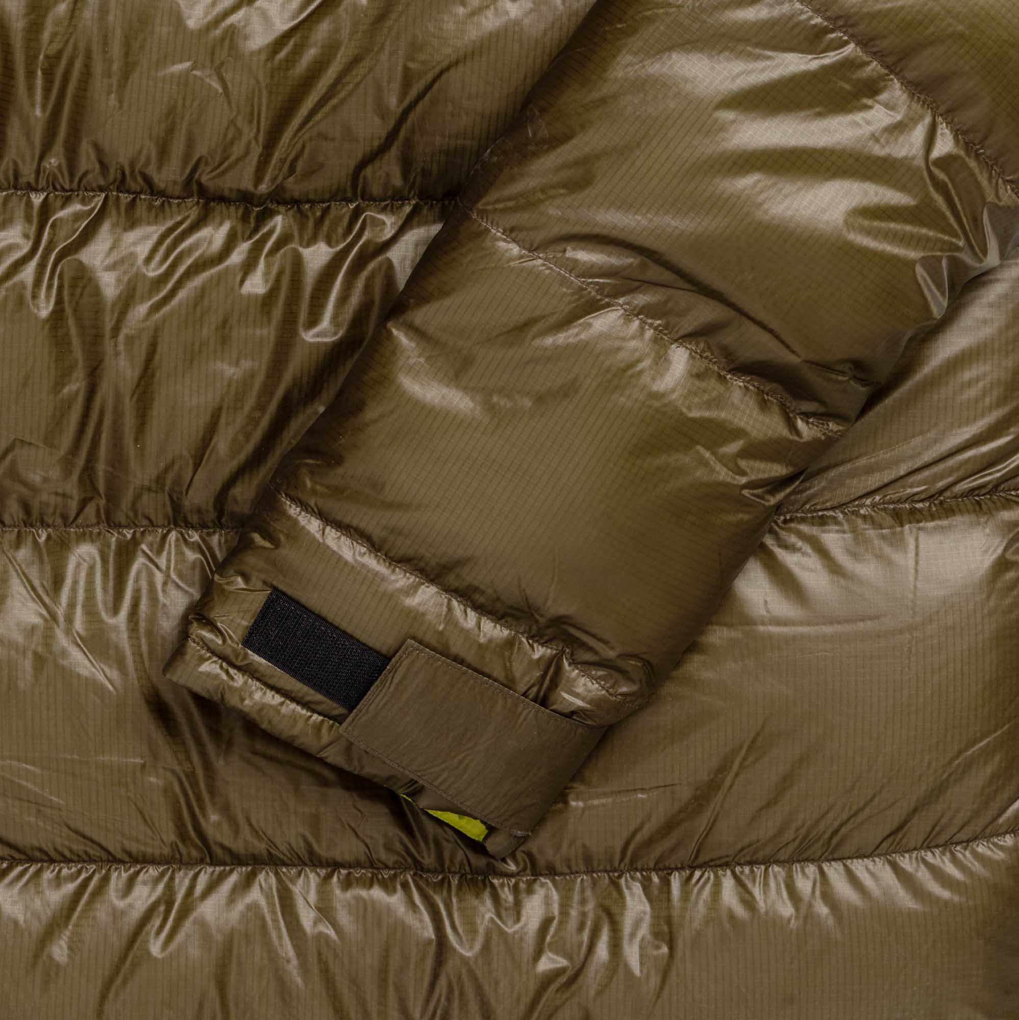Close view of the parka sleeve and adjustable hook-and-loop cuff.