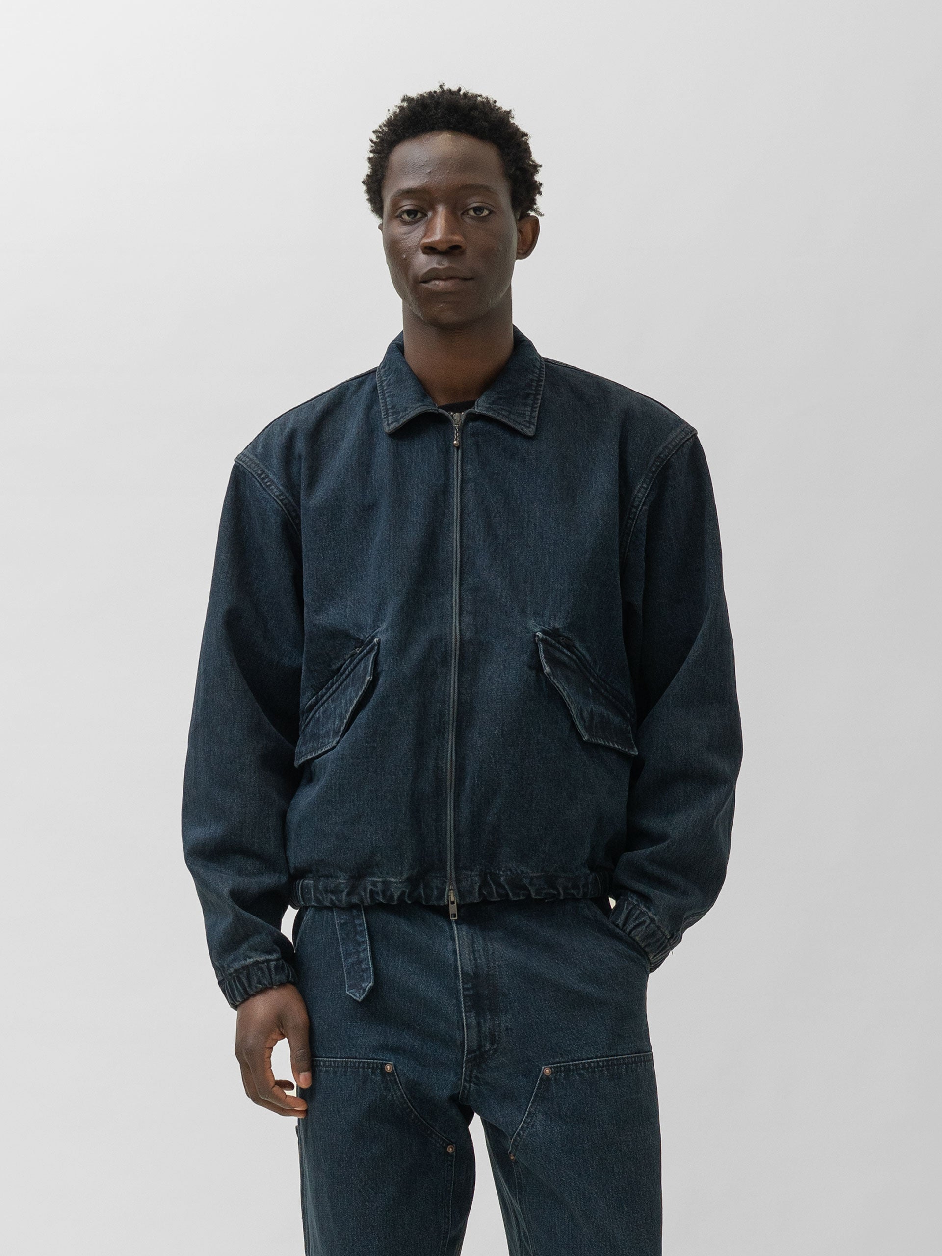 The A by BEAMS Denim Work Blouson worn zipped with matching dark denim trousers.