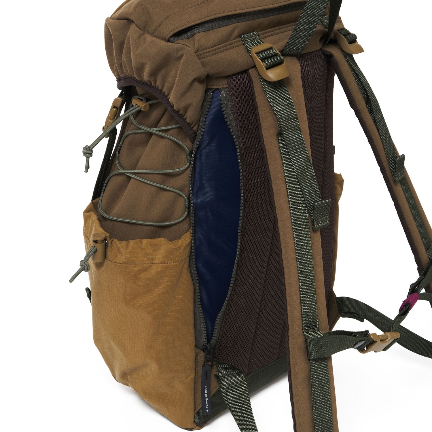 Open zip beside the backpack’s mesh back panel, showing the navy lining and a drawcord side pocket.