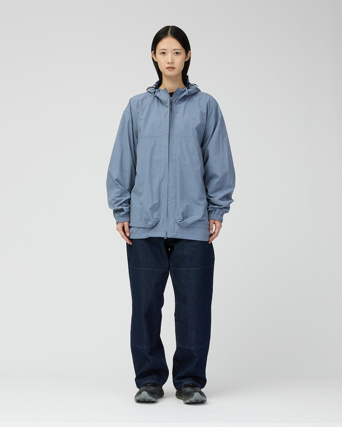 Front view of a model wearing the Light Blue Kasuri Ripstop Jacket.