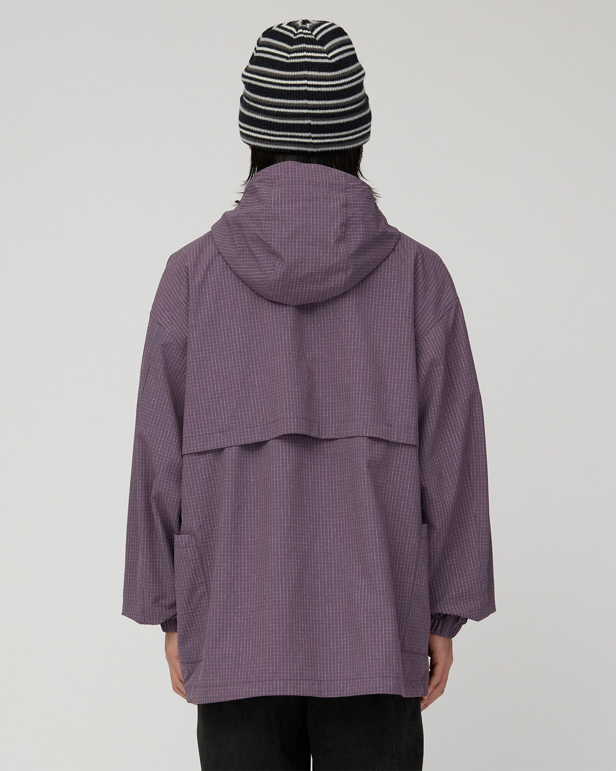 Rear view of the Dark Purple jacket with its hood and broad back ventilation panel.