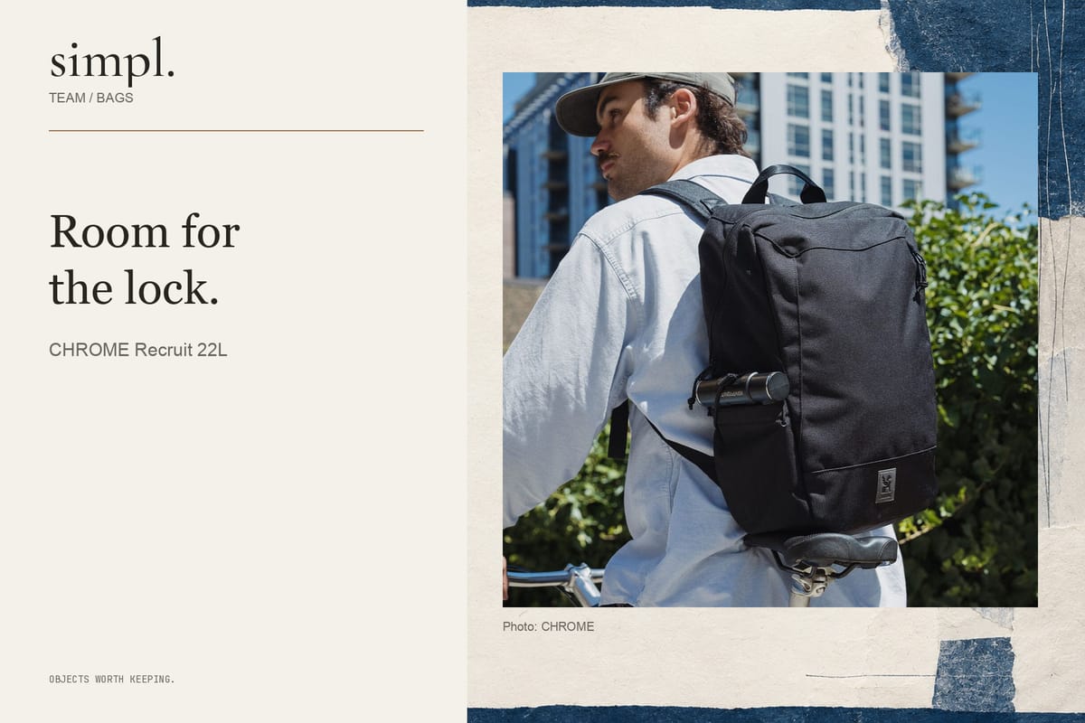 Black CHROME Recruit backpack worn outdoors with a U-lock in its side pocket.