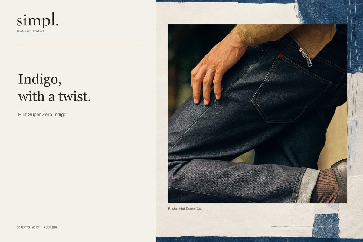 Close view of Hiut Super Zero Indigo denim worn with a brown jacket inside the simpl. branded feature cover.