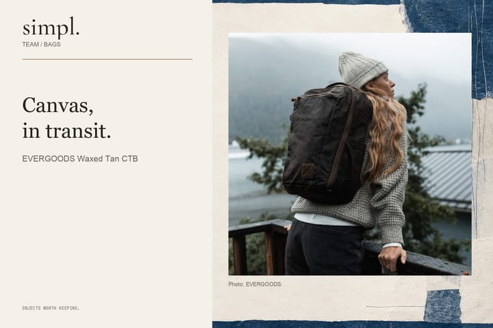 Waxed Tan CIVIC Travel Bag worn on the back beside an Alaskan waterside.